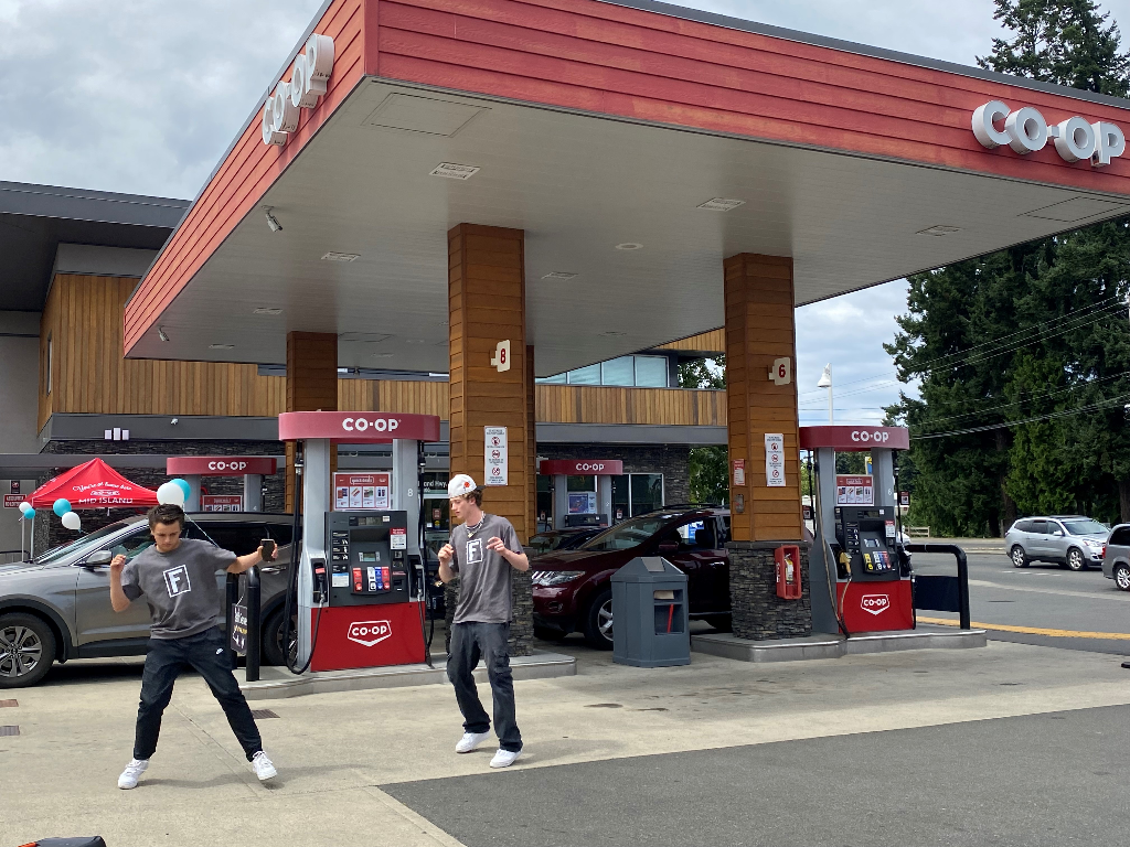 Dance duo Funkanometry in front of a Co-op gas bar