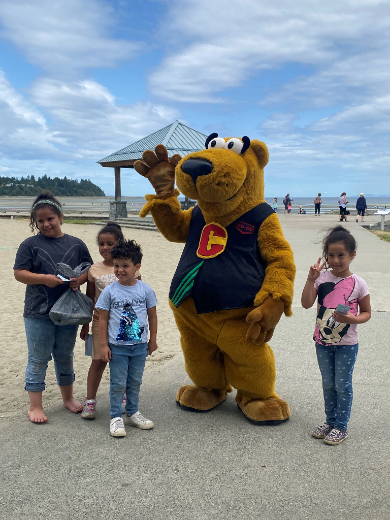 Co-op mascot Cooper with children